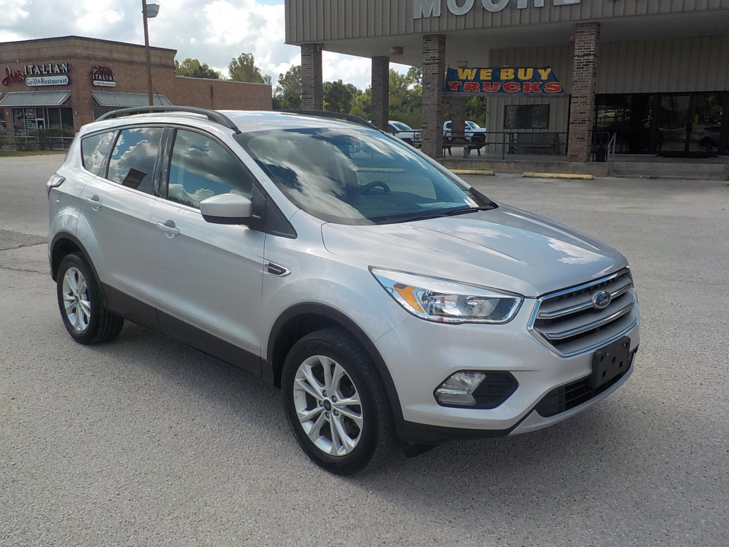 2018 Silver /Black Ford Escape SE 4WD (1FMCU9GD3JU) with an 1.5L L4 DOHC 16V engine, 6A transmission, located at 1617 W Church Street, Livingston, TX, 77351, (936) 327-3600, 30.710995, -94.951157 - 4X4!! Can use the 4X4 this time of year no doubt! Come check this one out for yourself!! - Photo#1