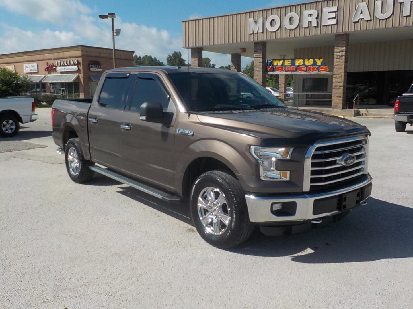 2015 Brown /Tan Ford F-150 XLT SuperCrew 6.5-ft. Bed 4WD (1FTEW1EF0FK) with an 5.0L V8 engine, 6-Speed Automatic transmission, located at 1617 W Church Street, Livingston, TX, 77351, (936) 327-3600, 30.710995, -94.951157 - ONE OWNER!! Been here in Livingston all it's life. This truck was well maintained! Buy it with confidence! - Photo#1